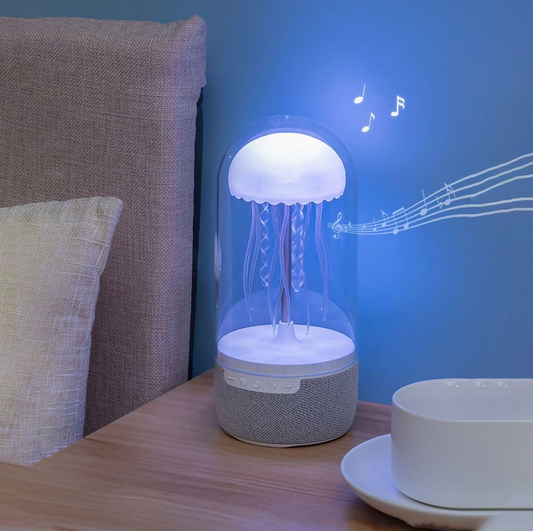 Rotating LED lamp with integrated speaker